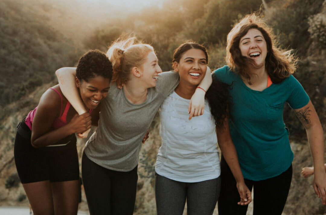 A group of women standing next to each other.